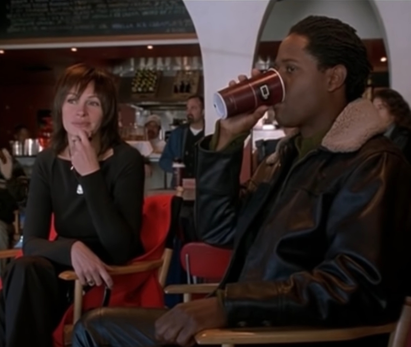 alt="Julia Robert sits behind the scenes in Full Frontal"