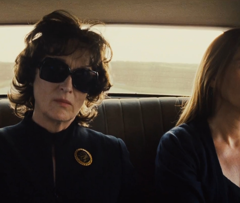 alt="Julia Roberts and Meryl Streep sit in a car in August: Osage County"