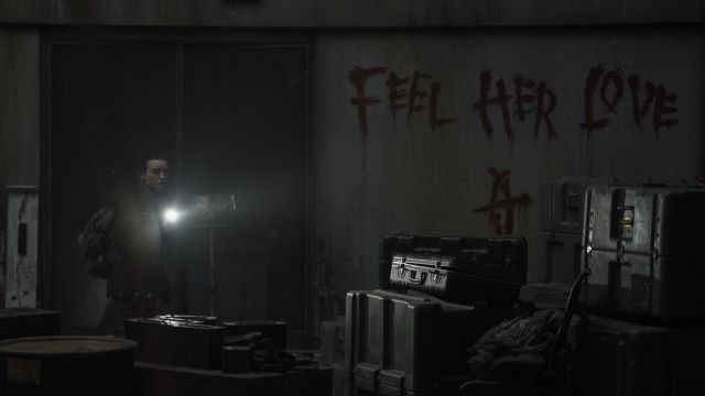 alt="Ellie at WLF next to Feel Her Love Seraphites sign.jpg"