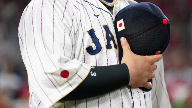 alt="World Baseball Classic Japan Jersey and Hat during national anthem"
