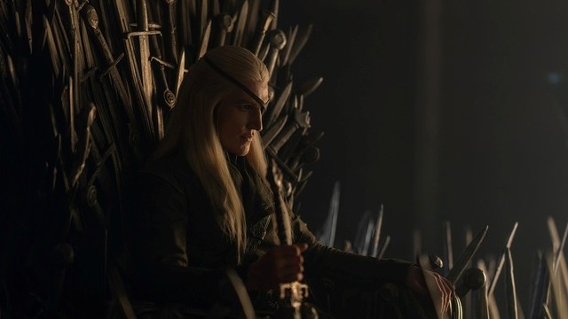 Aemond Targaryen sits on the Iron Throne in House of the Dragon Season 3.